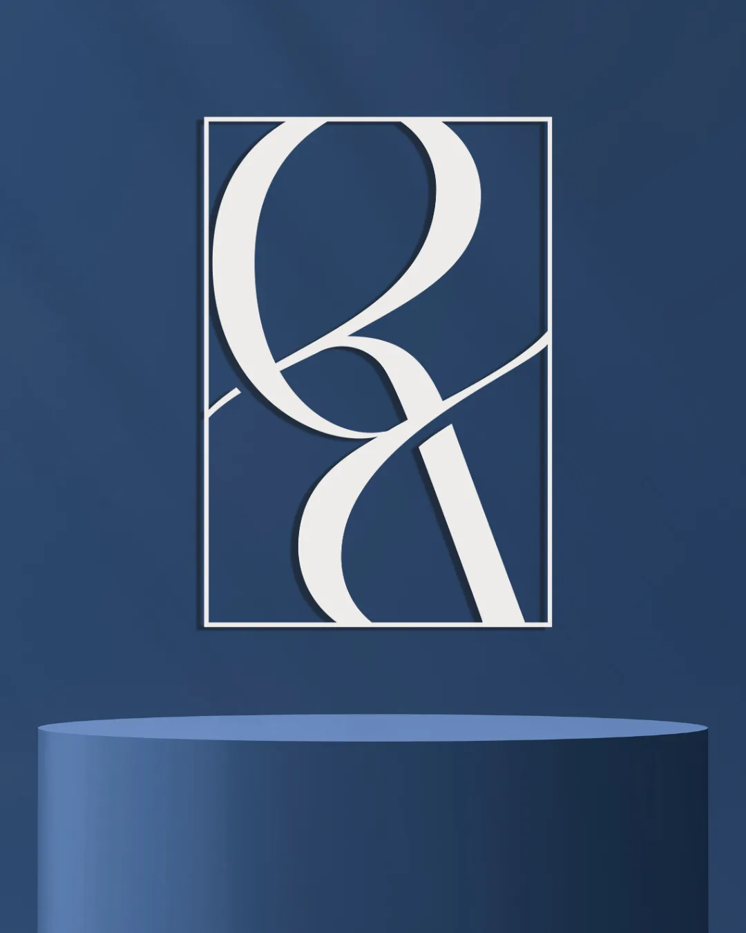 The Rosa Bello monogram: an R and a B interlocked as one continuous script line, framed white on deep navy.